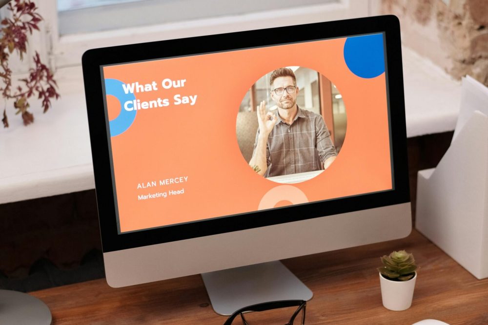 Stylish home office setup with computer showcasing client testimonials.